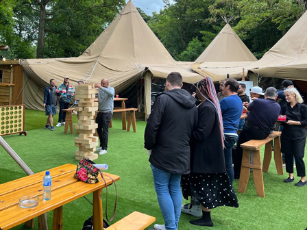 The UK team gathers for a summer picnic featuring jumbo Jenga!